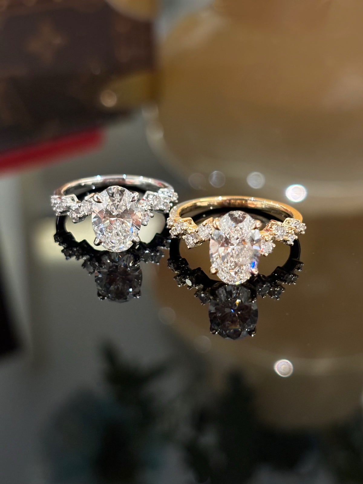 Oval diamond rings in white and yellow gold, original color comparison; one selected ring supplied