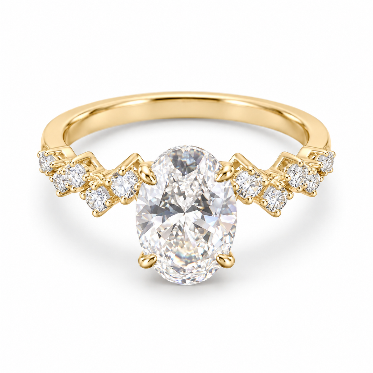 Oval lab-grown diamond ring in 18K yellow gold with four corner prongs and geometric diamond-set shoulders on white