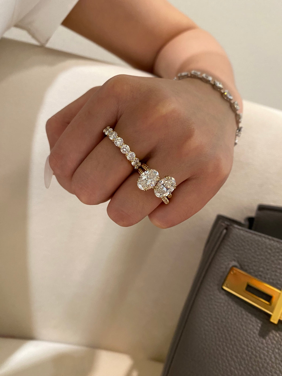 Oval rope-band ring design comparison on hand; other rings and bracelet not included
