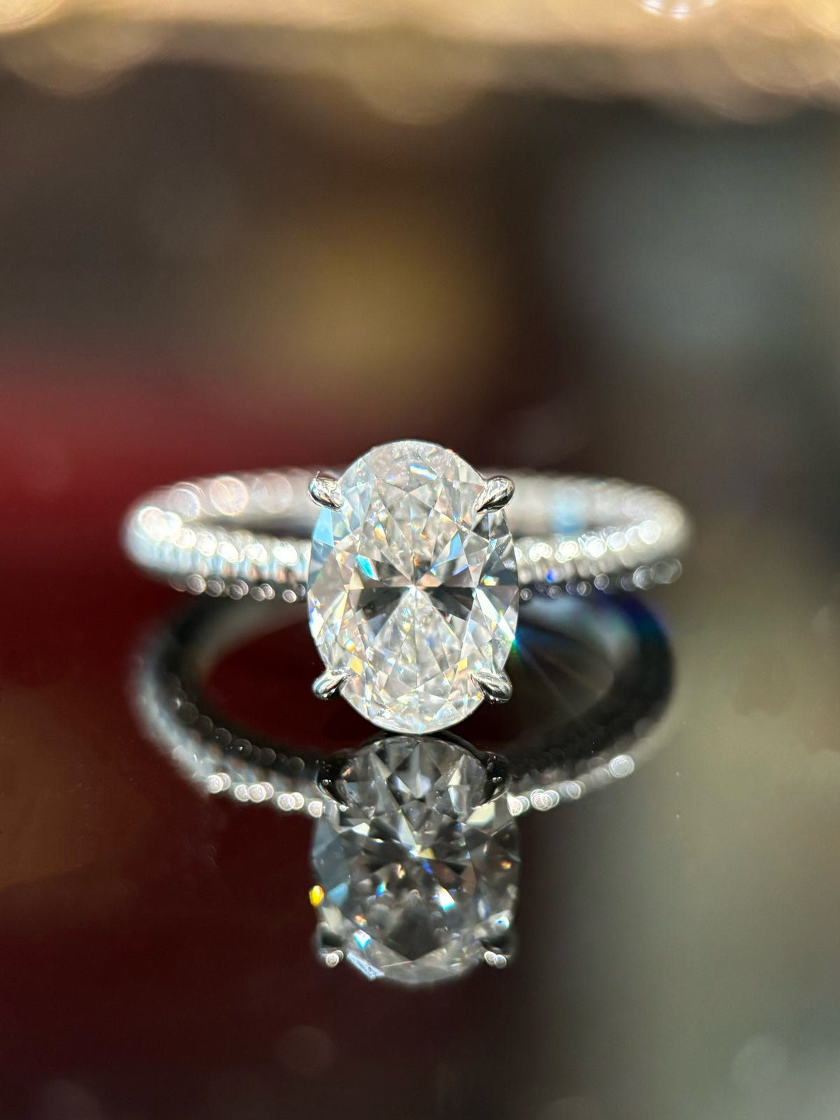 Oval diamond rope-band ring in white platinum, original frontal view with four single claws