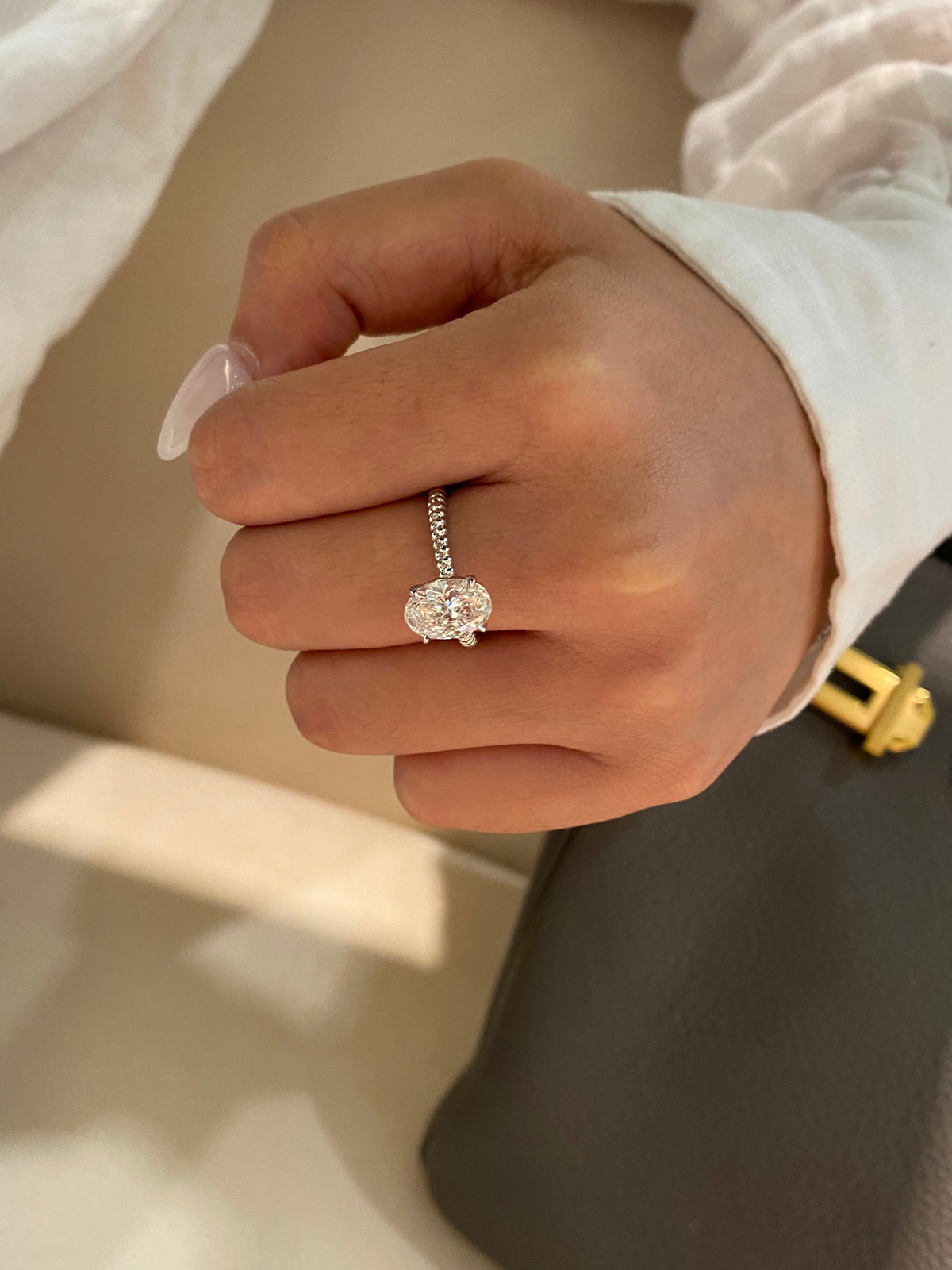 Oval diamond rope-band ring in white platinum, original wearing view 3; other jewelry not included