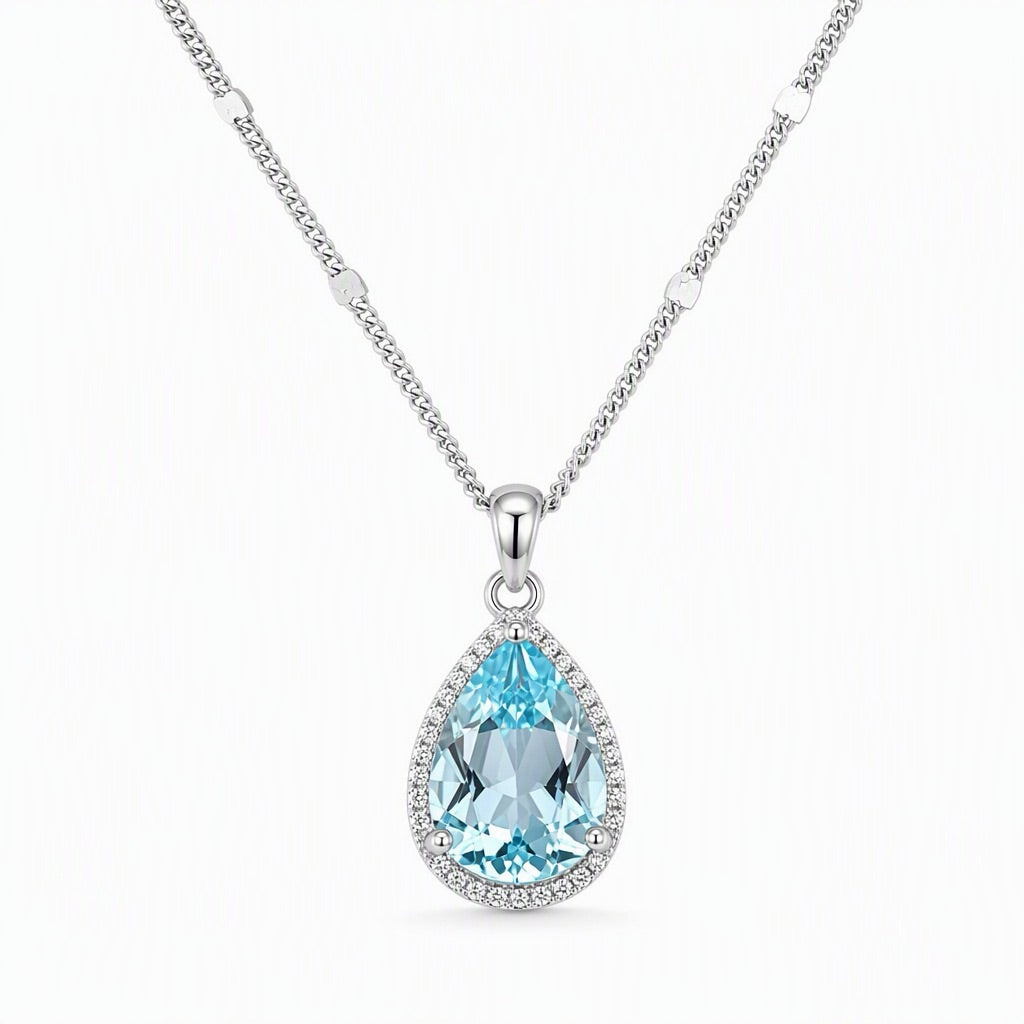 When the Rain Let Go — blue topaz pendant, white-background product view [asset:17e73de340a9]