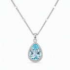 When the Rain Let Go — blue topaz pendant, white-background product view [asset:17e73de340a9]