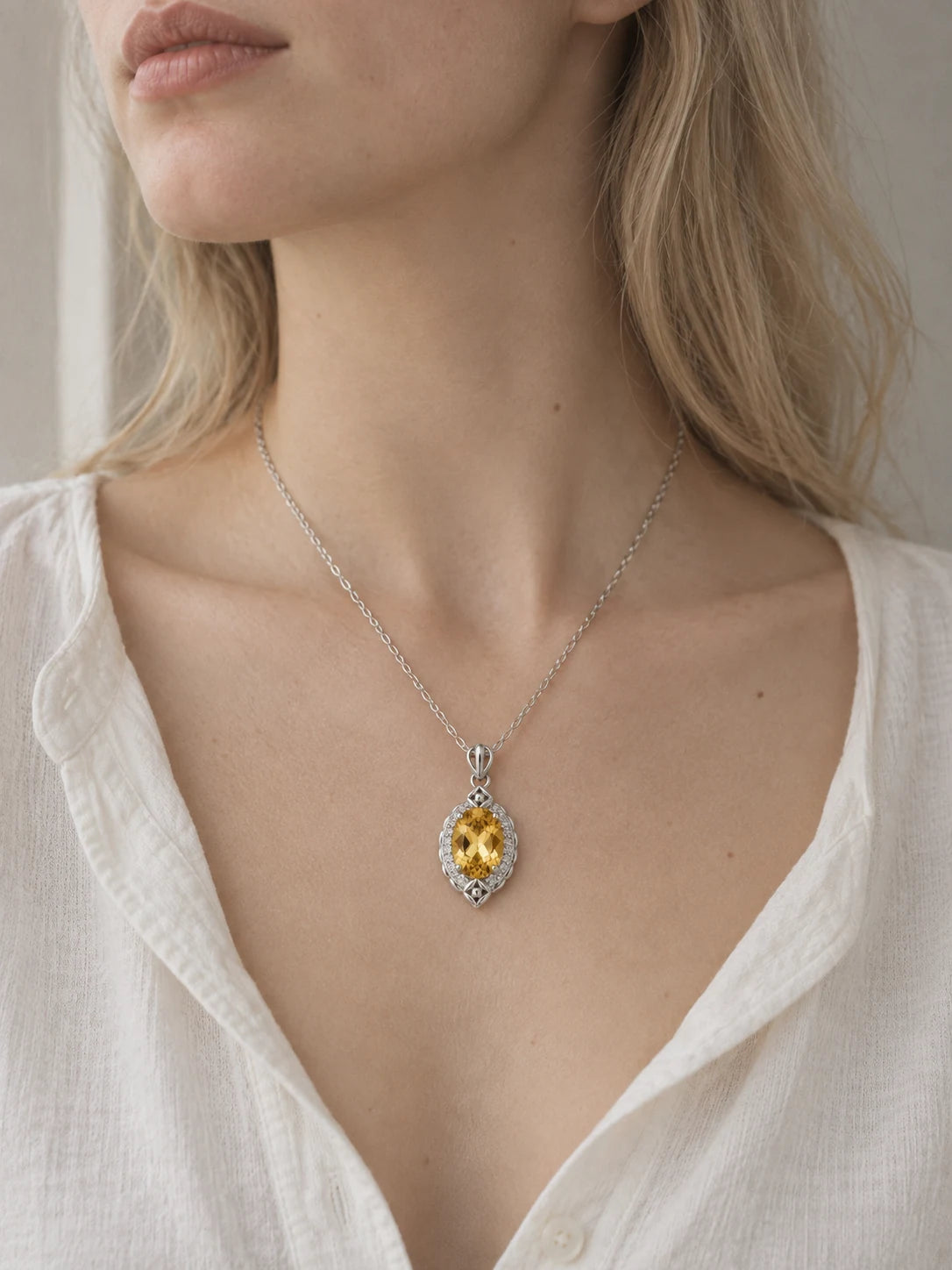 A Little Longer in the Sun — yellow pendant worn at the neckline
